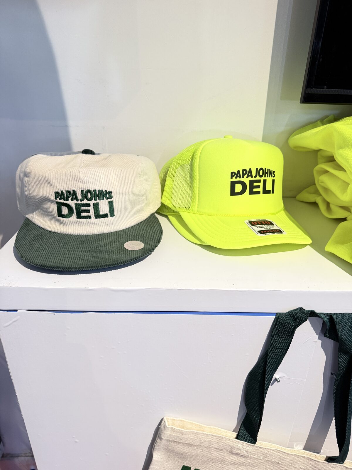 Custom caps and merch styled on a white counter