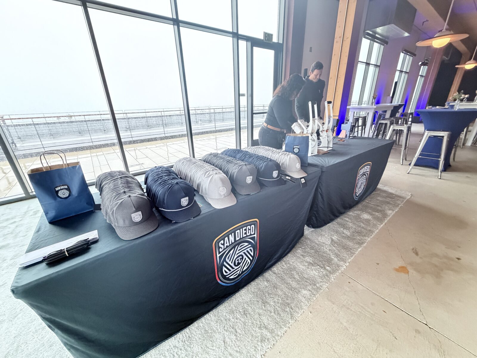 Daylight press setup at a rooftop Los Angeles corporate event with skyline windows